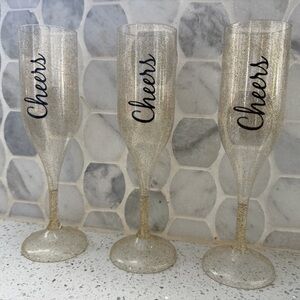 Set of Glittery Champagne Flutes with Cheers Design